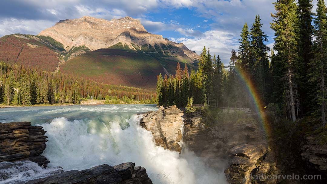 Rainbow in the mist of Athabasca Falls at Jasper National Park.