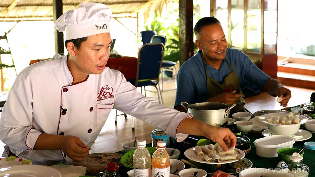 Chef Tan teaching Vietnamese cuisine to Shareef in Ho Chi Minh City.