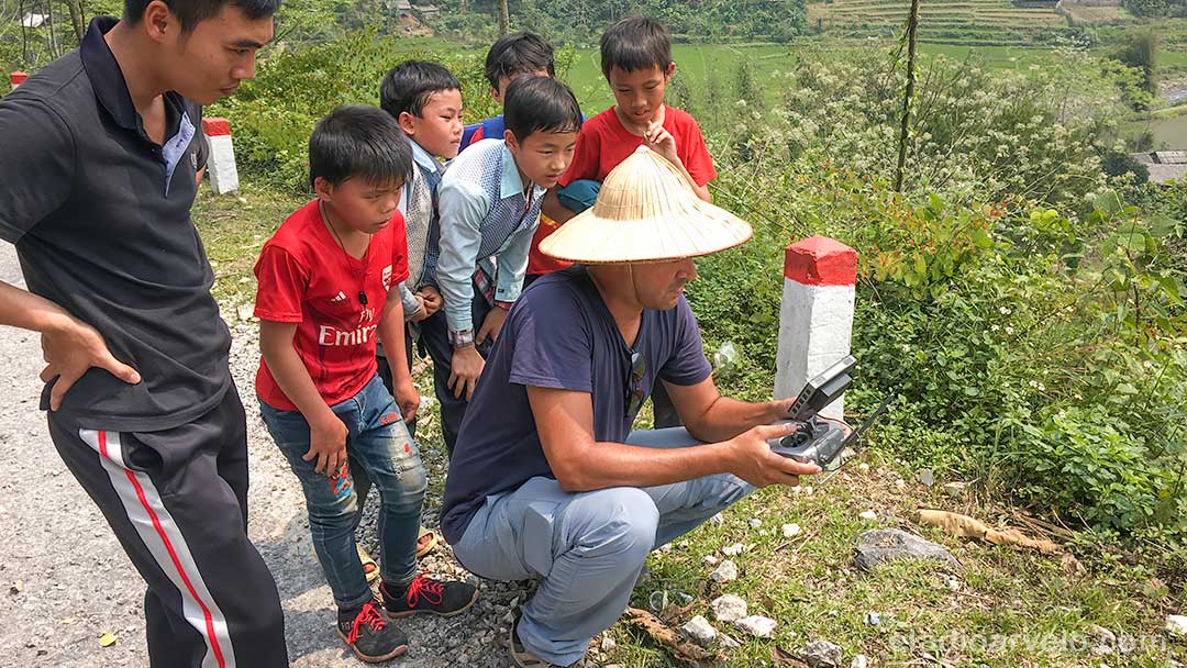 Eladio piloting his drone with an audience in Ha Giang. (Photo credit: Shareef Haq).